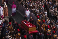 Pope Francis' body is carried in a coffin into Saint Peter's Basilica